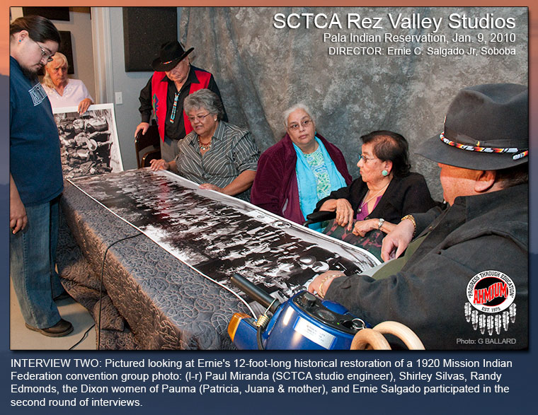INTERVIEW TWO: Pictured looking at Ernie's 12-foot-long historical restoration of a 1920 Mission Indian Federation convention group photo...