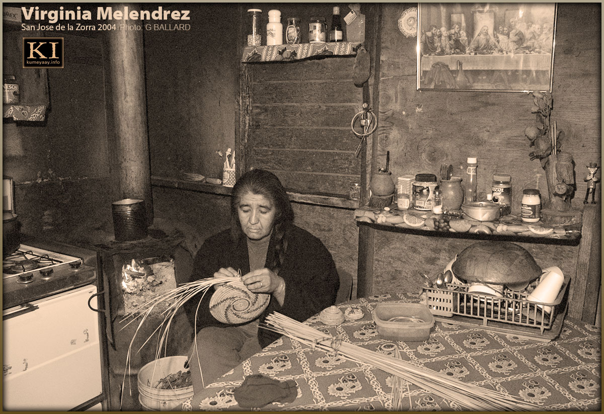 KUMIAI BASKET MAKER in her home weaving juncus tribal basket