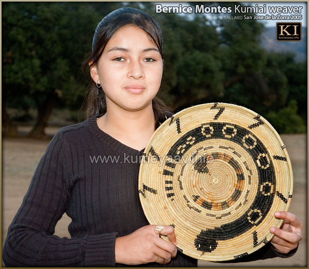 Bernice Montestakes a photo with her first large tribal rattlesnake coiled juncus baskets in 2005